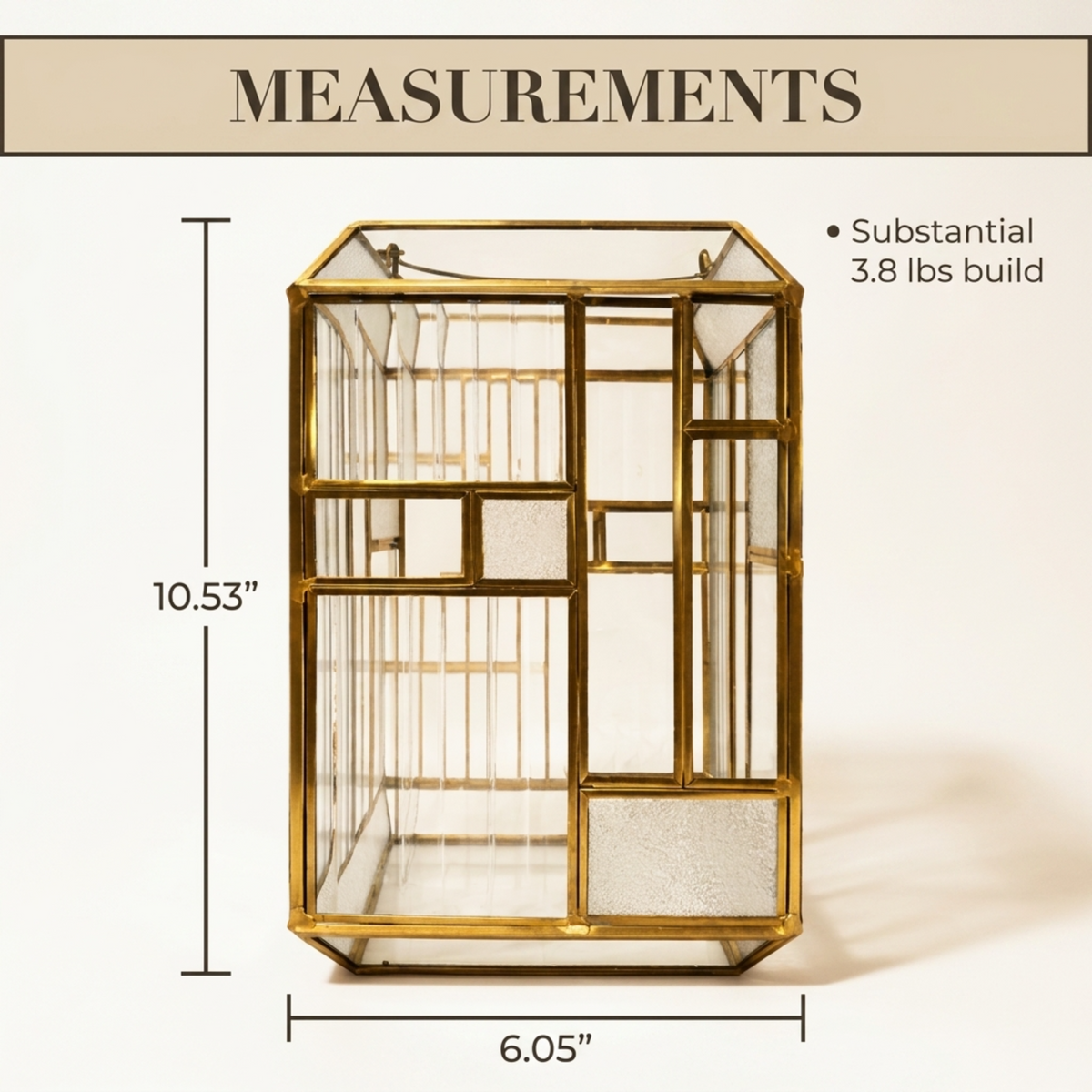 Gold metal frame glass candle holder lantern with intricate design, perfect for decorative lighting and ambiance.