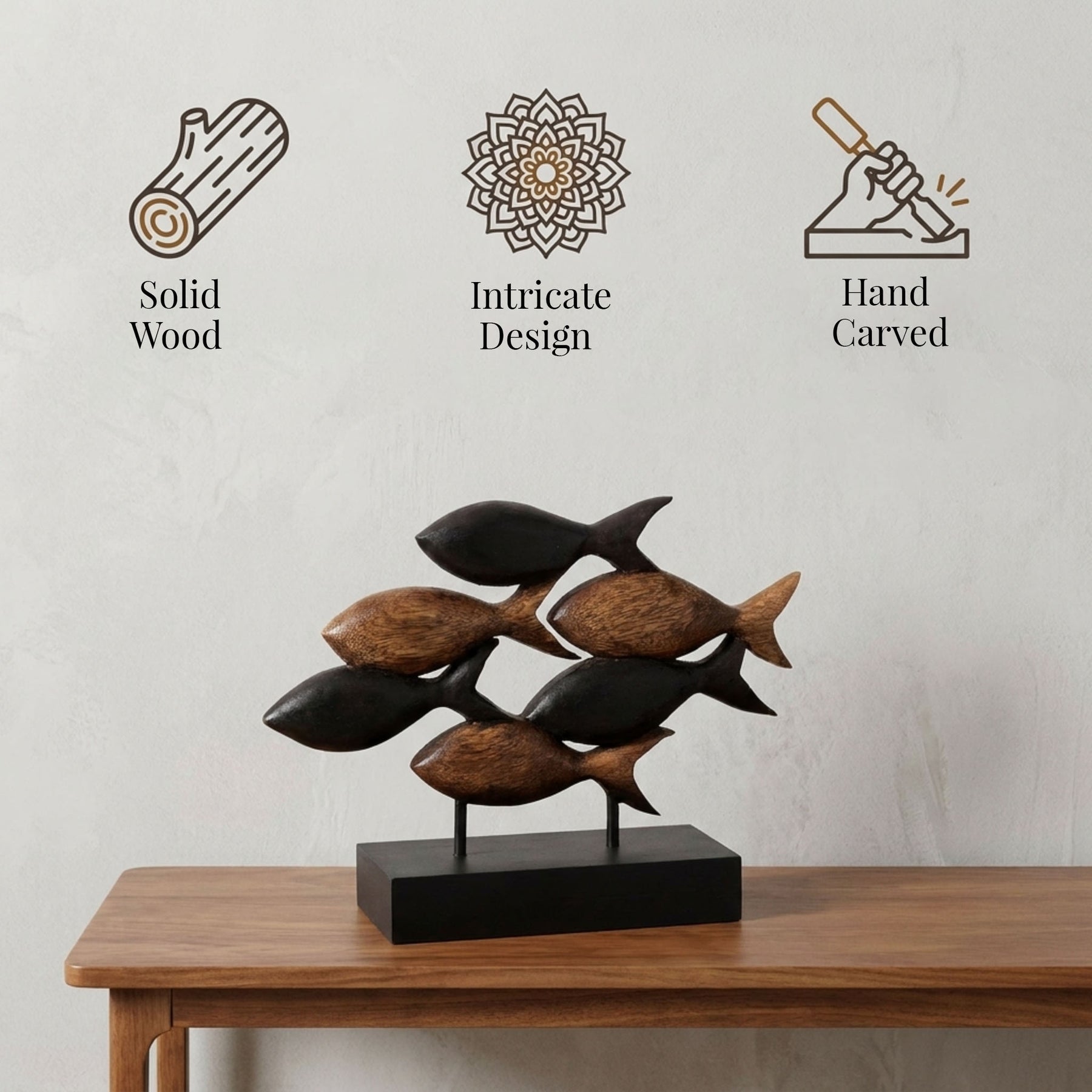 a wooden sculpture of a fish, with three different design elements displayed above it.