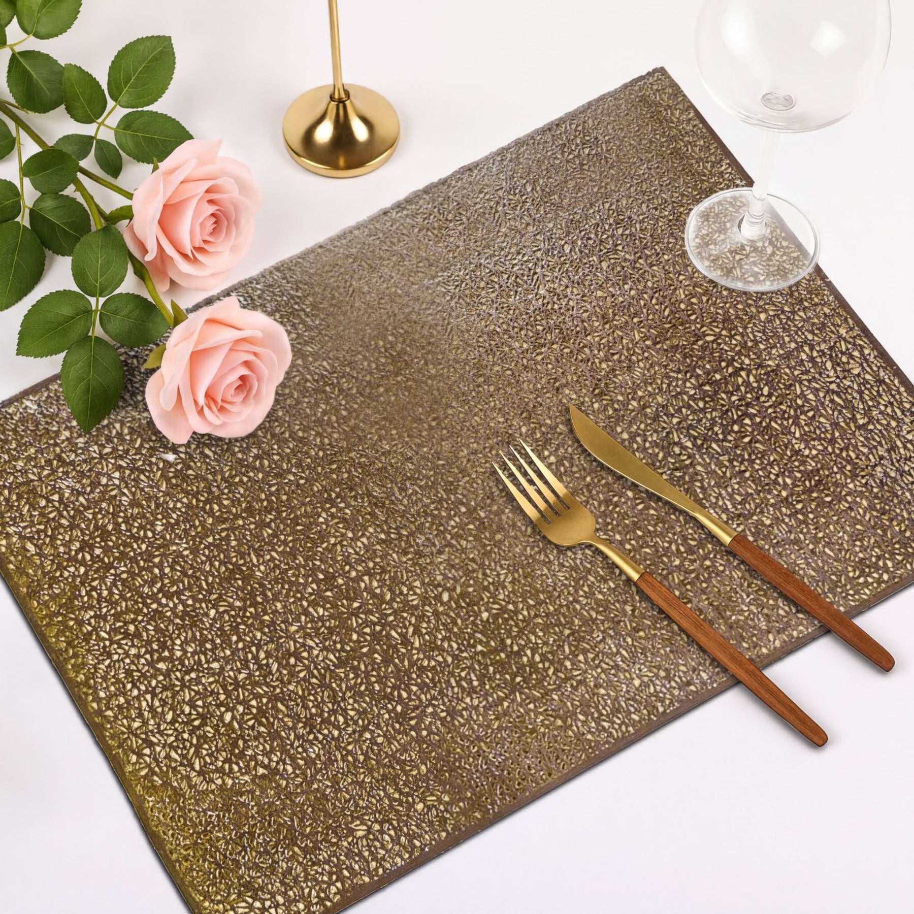Set of six gold PVC cut out placemats with intricate designs, ideal for protecting surfaces and enhancing table decor.