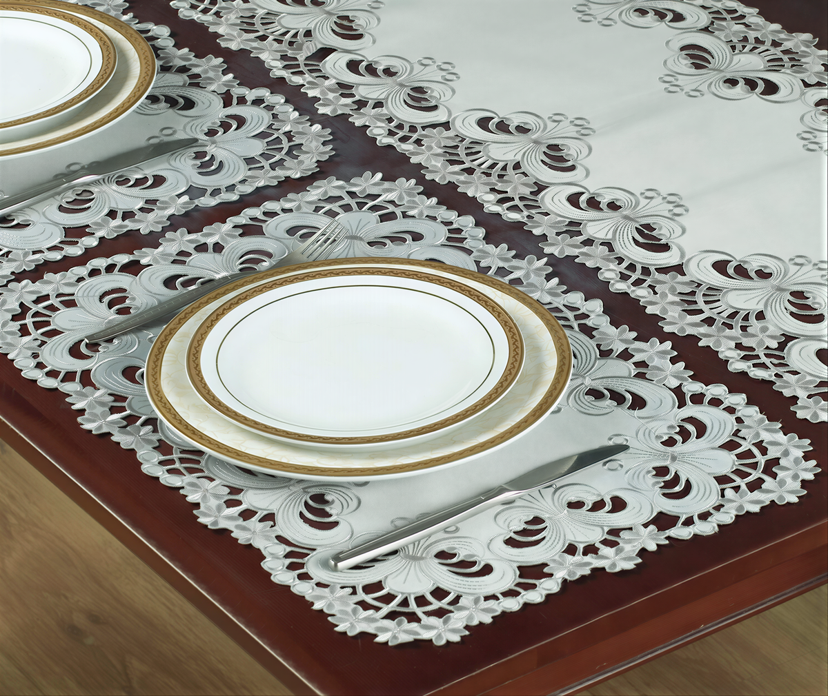 Set of six linen placemats with European embroidery from the Creola Collection, featuring intricate floral designs.