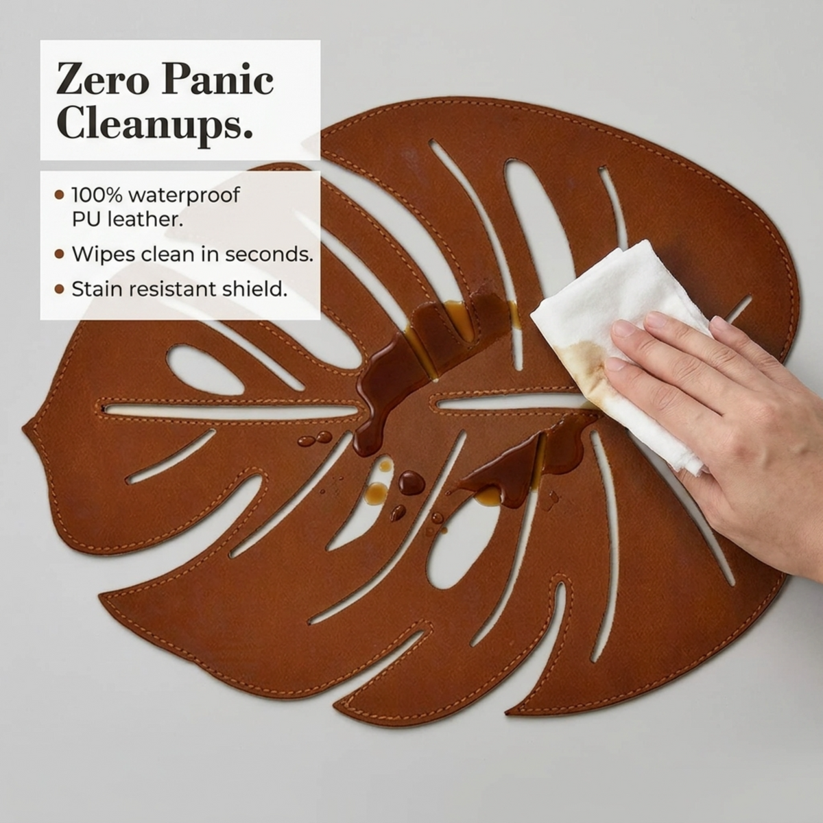 Set of six Monstera leaf cut out leather placemats in brown, featuring tropical leaf design, perfect for dining table decor.