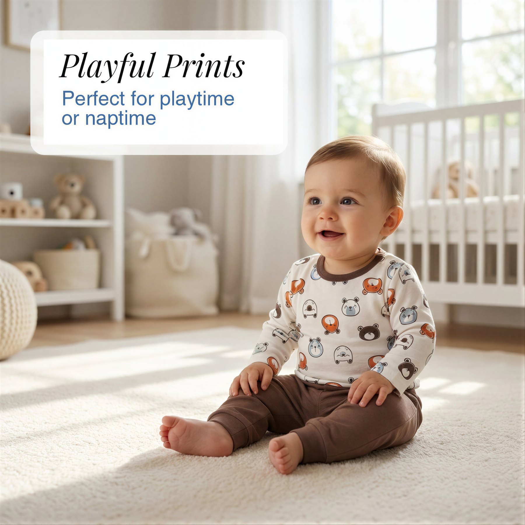 A smiling baby sitting on a carpeted floor in a nursery, wearing a long-sleeved shirt with animal designs.