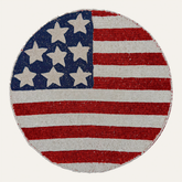 Set of two beaded USA flag round placemats featuring patriotic red, white, and blue star accents, perfect for American-themed dining.