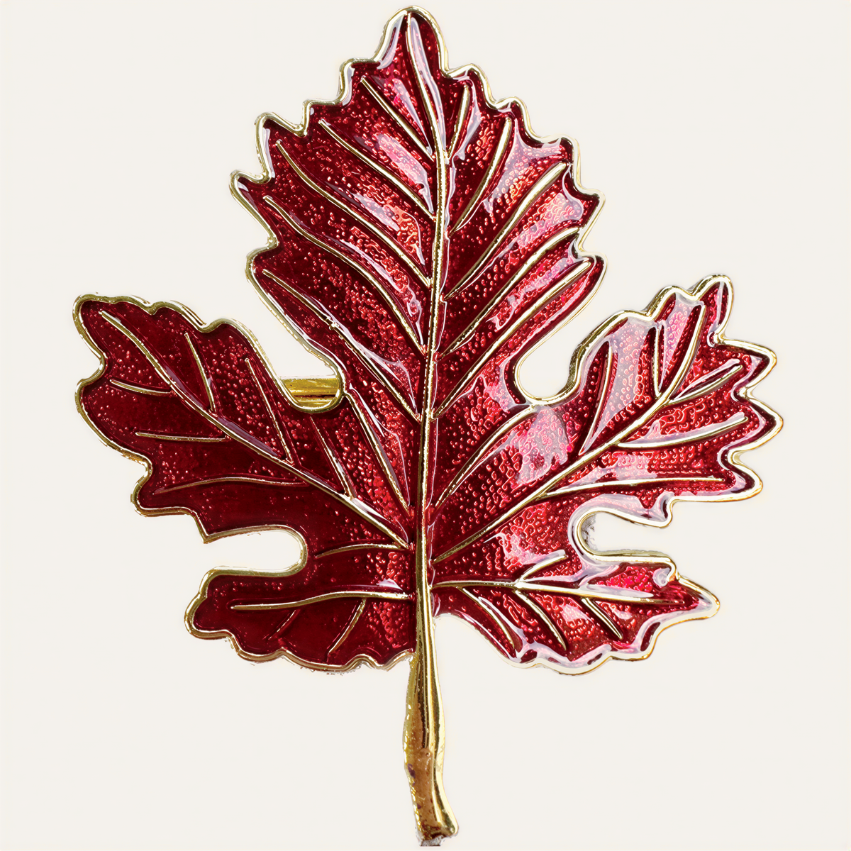 Set of four Golden Ember napkin rings with gold and red maple leaf design, decorative dining table accessory.