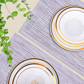 Set of four PVC placemats for dining table, durable and easy to clean, by brand 31730, showing colorful, textured surface.