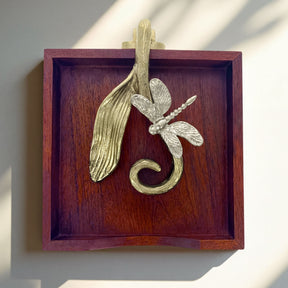 Solid wood napkin holder with silver and gold finish ornament, stylish dispenser for table or countertop use.