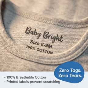 a close-up of a gray baby shirt with a label indicating the size and material.
