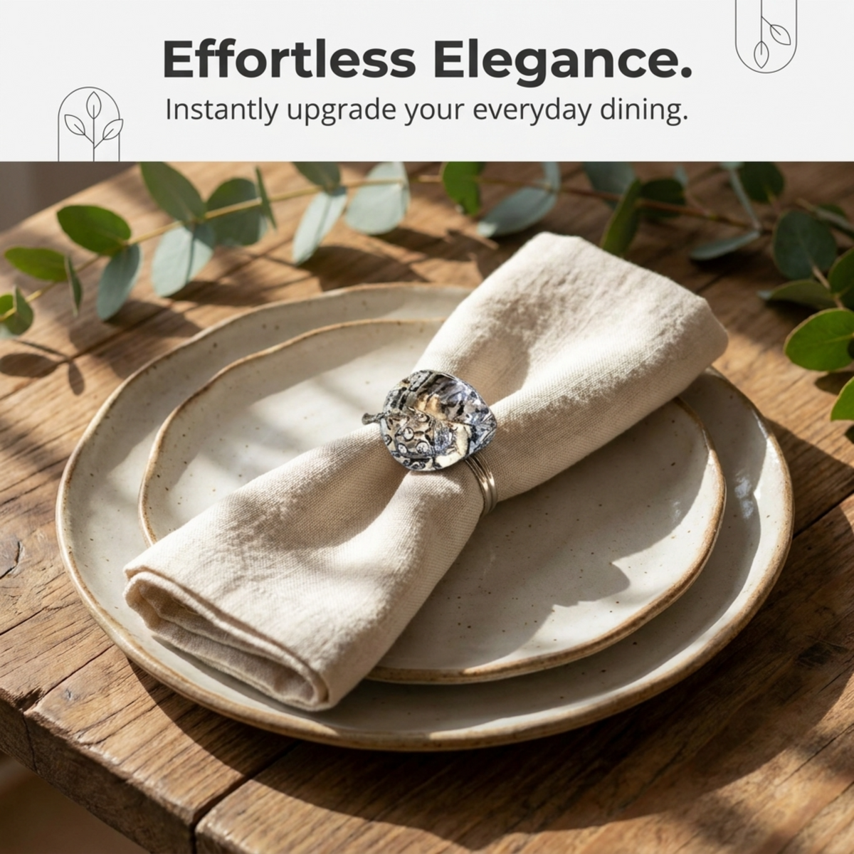 a white plate with a decorative napkin ring on it, placed on a wooden table.