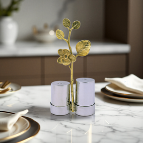 Salt and pepper shaker set for kitchen décor, featuring stylish ceramic shakers with black and white design.