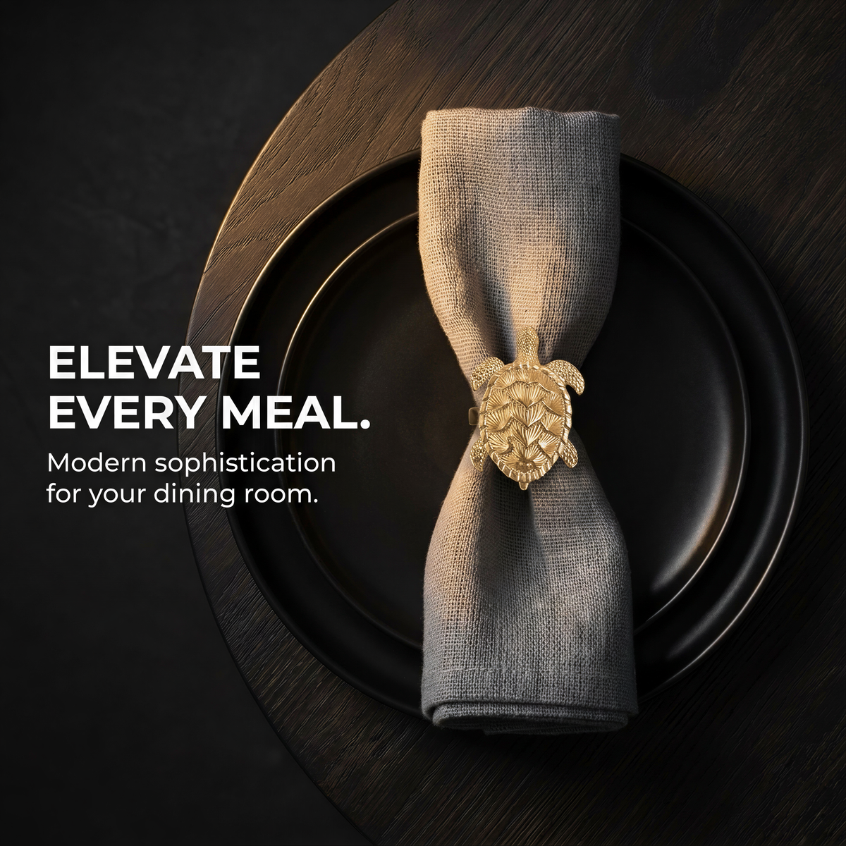 A black plate with a gold-colored turtle-shaped napkin ring on it, accompanied by the text "Elevate EVERY MEAL. Modern sophistication for your dining room."