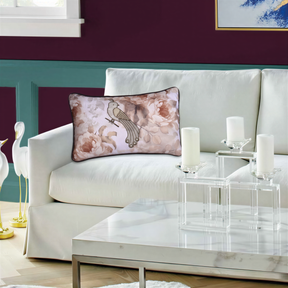 a living room with a white sofa, a glass coffee table, and a decorative pillow with a floral design.