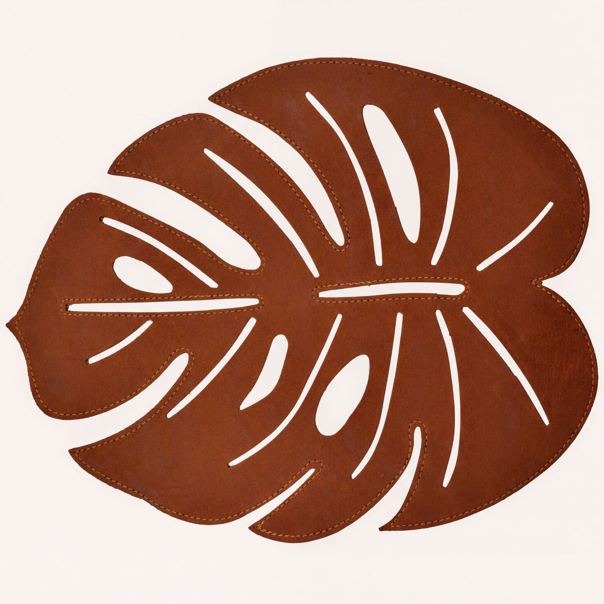 Set of six Monstera leaf cut out leather placemats by ACM1206-BRN, showcasing stylish, nature-inspired design on smooth leather.
