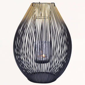 Black and gold candle holder lantern from CA9943-MB, decorative candle lantern with intricate design and glass panels.