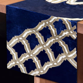 Embroidered decorative table runner with intricate floral patterns, designed for elegant dining tables.