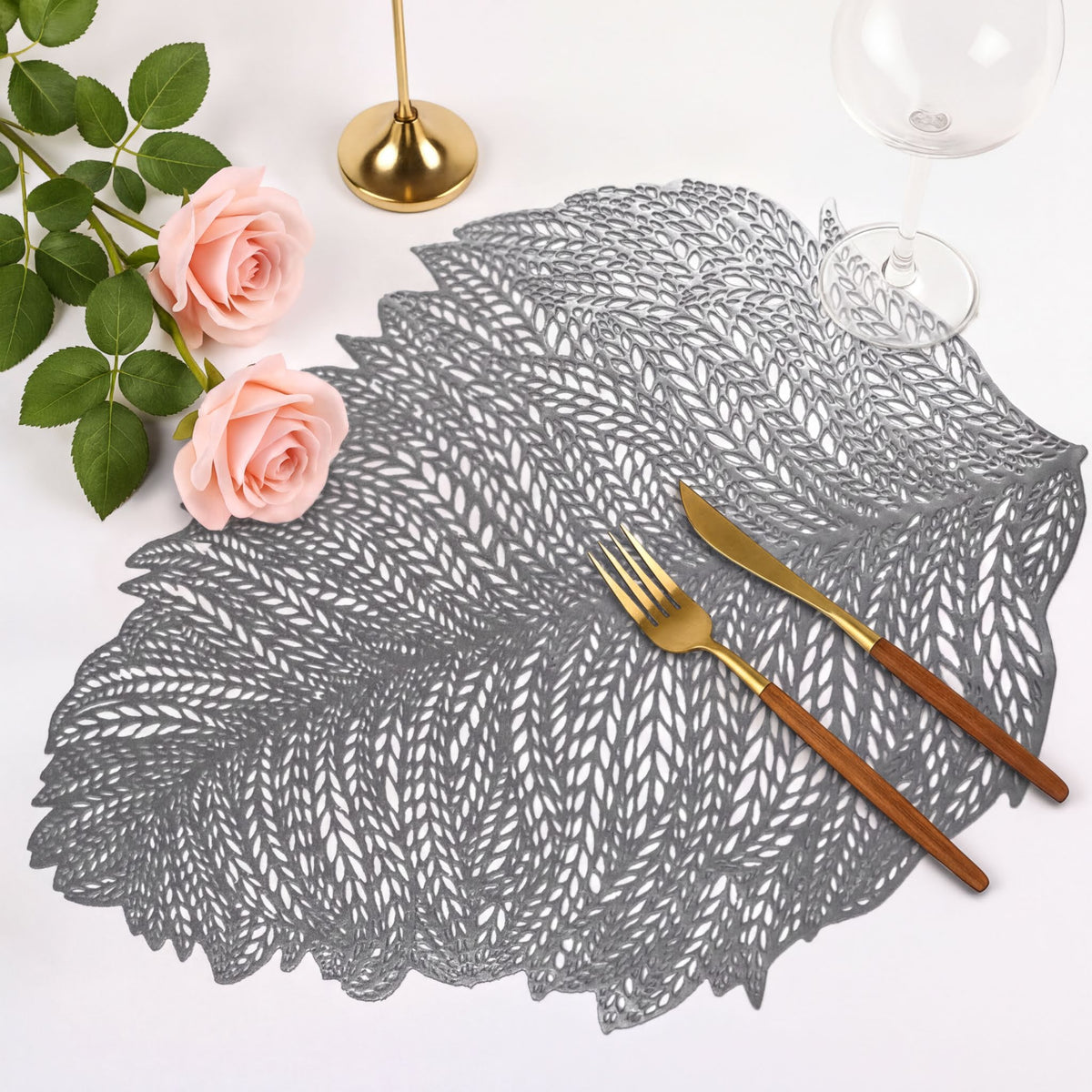 Set of six leaf-shaped cut out vinyl placemats by AMF033-SLV featuring elegant leaf design for dining tables.