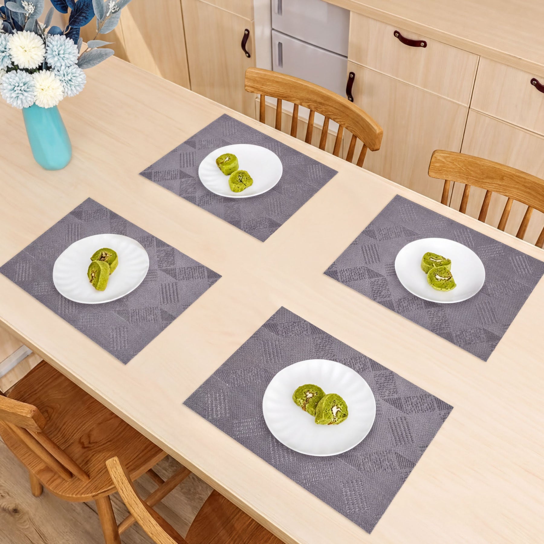Set of four PVC placemats for dining table by 81702, featuring durable, easy-to-clean surface for tabletop protection.