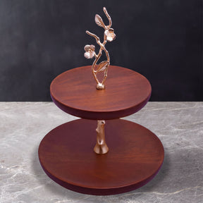 Two-tier wooden cake stand for kitchen décor, featuring a natural wood finish and classic design.
