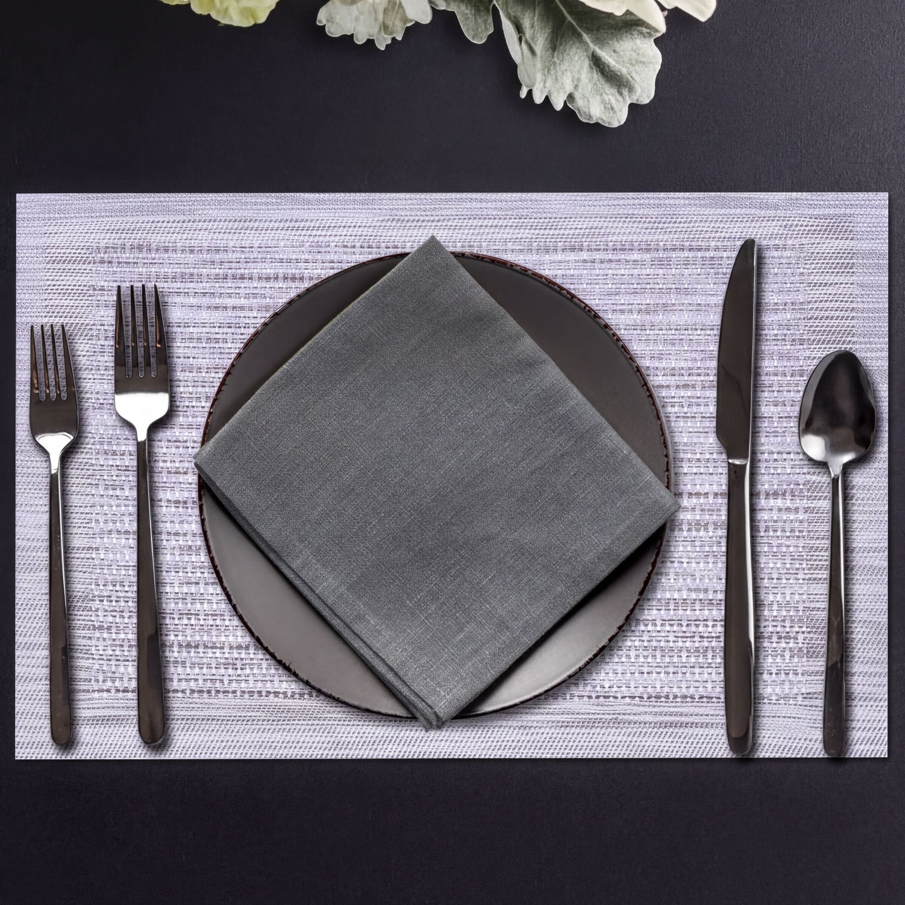 Set of four PVC placemats for dining table, made by 31730, featuring durable, easy-to-clean surface in a stylish design.