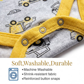 a close-up view of a baby onesie with a yellow and gray pattern featuring construction vehicles. The onesie has a yellow zipper and buttons, and it appears to be machine washable, stretch-resistant, and reinforced with button snaps.