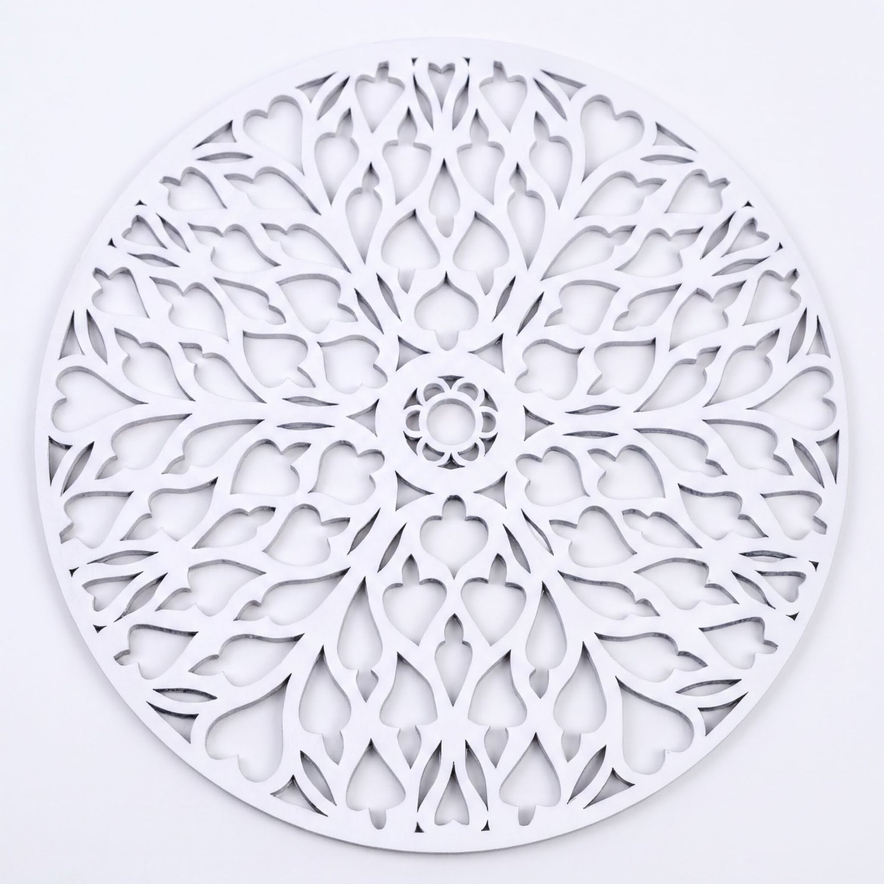 a circular design with a floral pattern, including a central flower and a repeating pattern of leaves and petals.