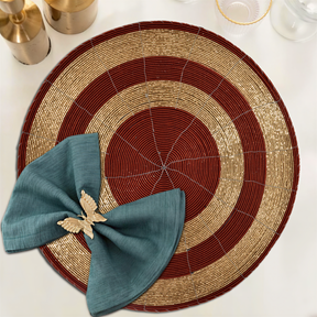 Set of four Decozen Aidden Bloom beaded placemats, 14-inch decorative table decor with intricate beaded design from The Aidden Collection.