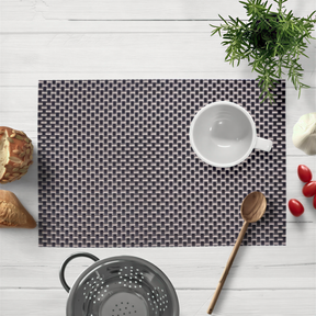 Black and gold PVC placemats with a decorative design, heat-resistant, washable, and suitable for indoor and outdoor dining.