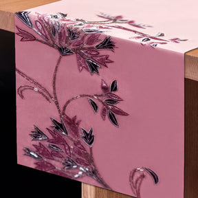 Embroidered decorative table runner with intricate floral patterns, designed for elegant dining table decor.