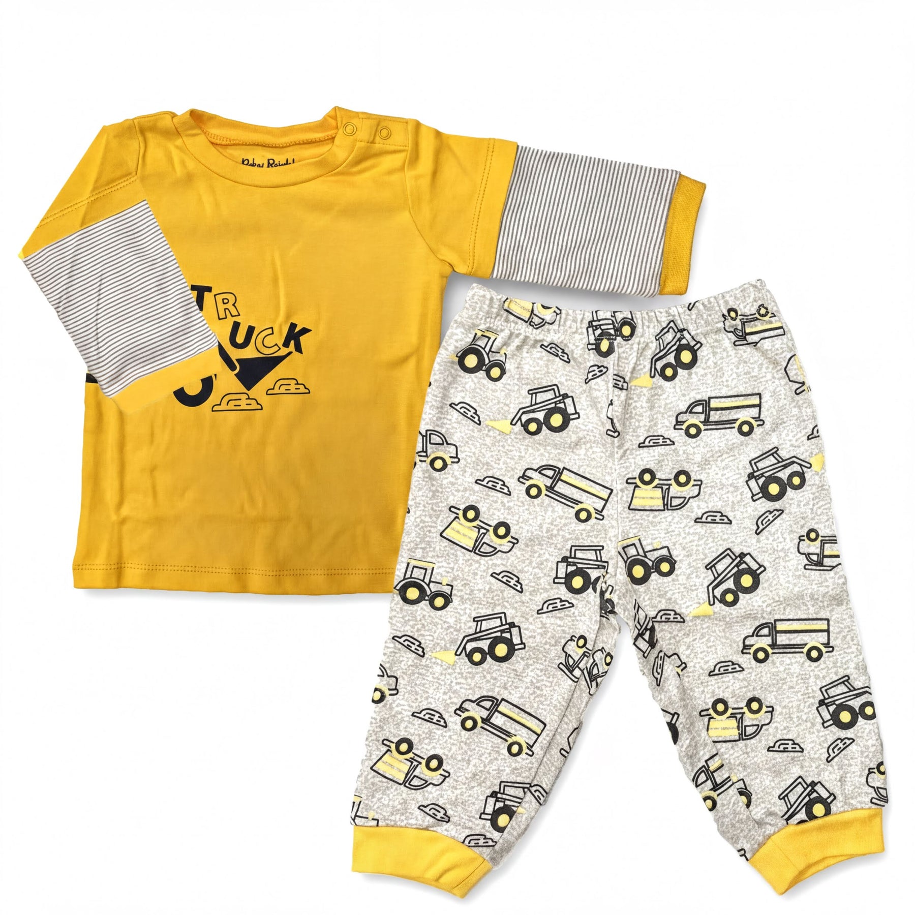 A yellow long-sleeved shirt with a truck design and a pair of patterned pajama pants with truck designs.