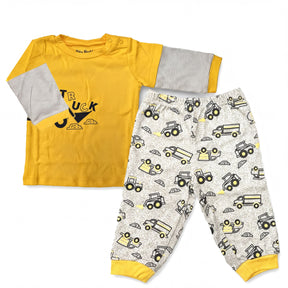 A yellow long-sleeved shirt with a truck design and a pair of patterned pajama pants with truck designs.