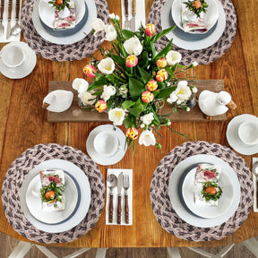 Set of six round PVC placemats with cut-out designs from AXM026H-103, perfect for protecting tabletops and enhancing dining decor.