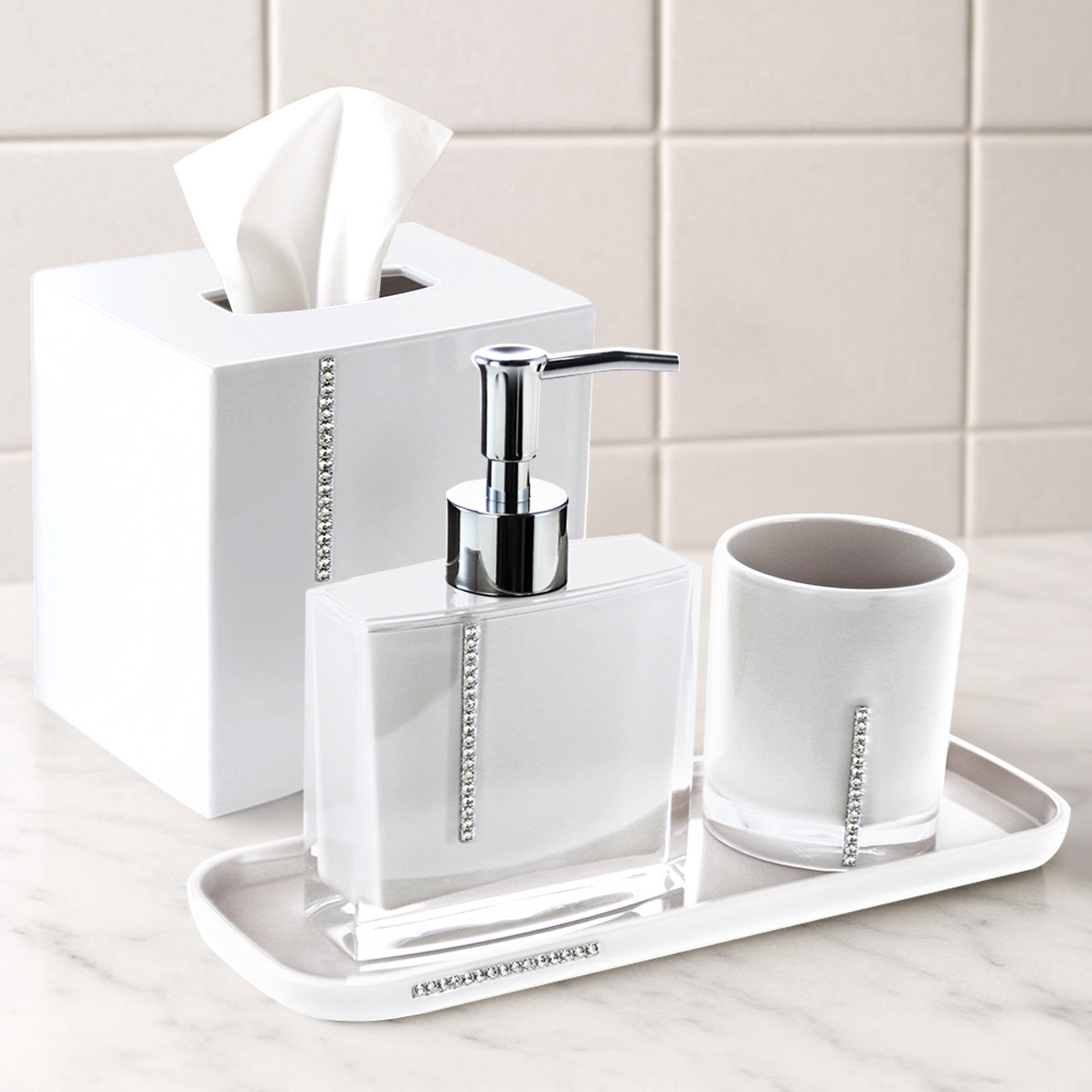 Set of four crystal white bathroom accessories including soap dish, toothbrush holder, tumbler, and soap dispenser.