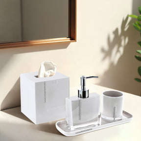 Set of four crystal white bathroom accessories, including soap dispenser, toothbrush holder, tumbler, and soap dish from B031CWH.