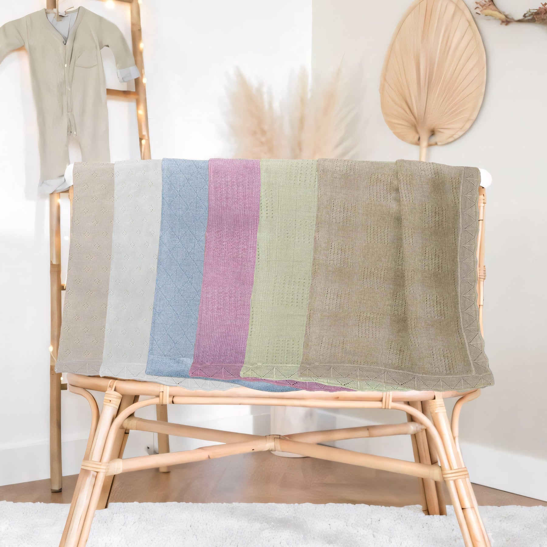 a wooden chair with a colorful striped blanket draped over it, placed in a room with a baby changing station and a decorative wall hanging.