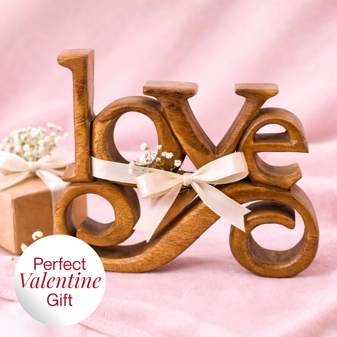 Hand-carved wooden sculpture from Forever Bloom, featuring intricate details, used as decorative wooden décor for home art.