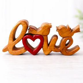 Hand-carved wooden sculpture titled Amber Affection, a handmade decorative wooden décor piece by LAY016 for home art display.