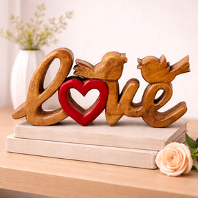 Hand-carved wooden sculpture titled Amber Affection by LAY016, showcasing intricate craftsmanship in handmade wooden décor.