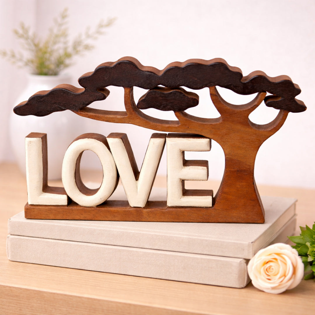 Hand-carved wooden sculpture titled Elmija Enduring Love by LAY020, featuring intricate craftsmanship and natural wood finish.