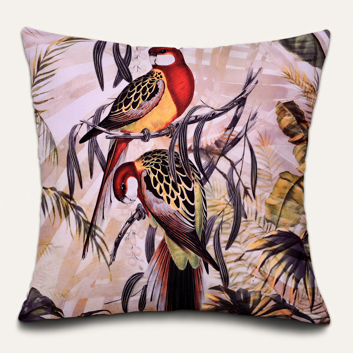 A decorative pillow with a vibrant, colorful illustration of two parrots perched on branches amidst tropical foliage.
