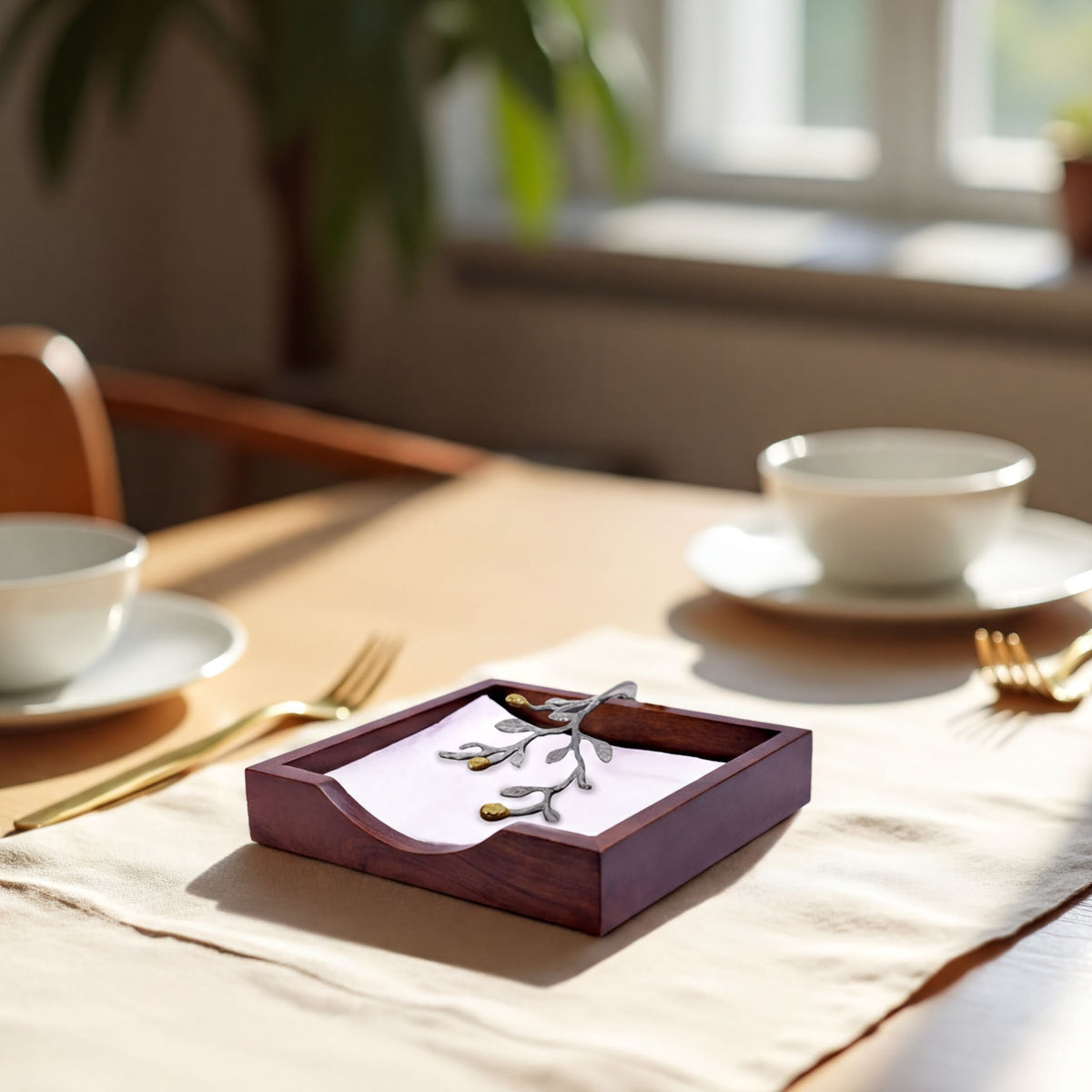 Solid wood napkin holder with silver and gold finish ornament for elegant table decor, part of napkin holders and dispensers collection.