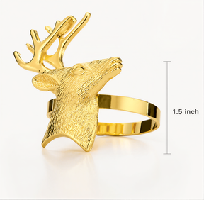 A gold-colored metal ring in the shape of a deer head, with antlers on top.