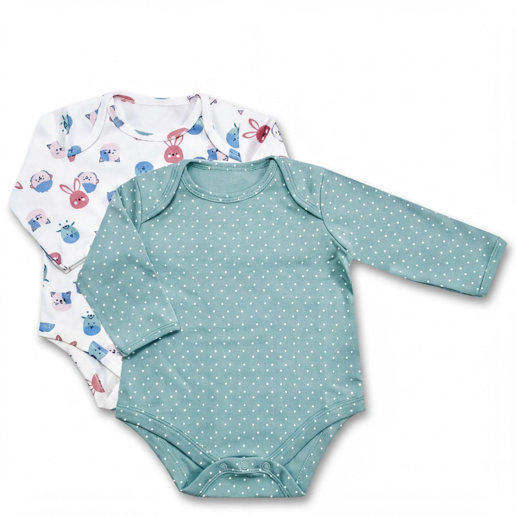 two baby onesies, one with a polka dot pattern and the other with a bunny pattern, both featuring long sleeves.