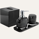 Set of four modern bathroom décor accessories from The Aurik Collection, including soap dispenser, toothbrush holder, and matching containers.