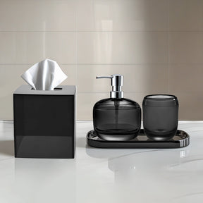 Elegant modern bathroom décor accessories set of 4 from The Aurik Collection, including soap dispenser, toothbrush holder, and matching accessories.