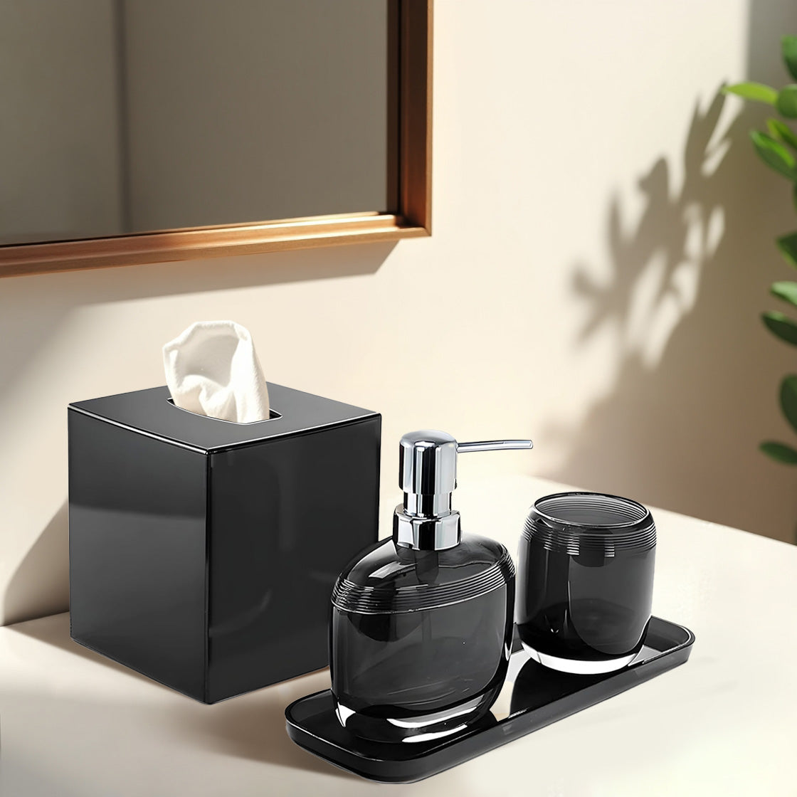 Set of four modern bathroom décor accessories from The Aurik Collection, featuring sleek and elegant design in a stylish bath set.
