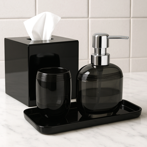 Set of four modern bathroom decor accessories from The Aurik Collection, featuring sleek, elegant design in a contemporary style.