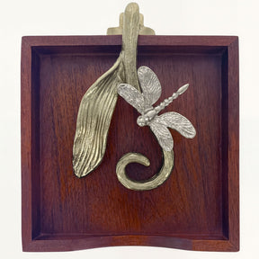 Solid wood napkin holder with silver and gold finish ornament, stylish dispenser for elegant table settings.