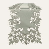 a decorative table runner with intricate floral patterns and designs.