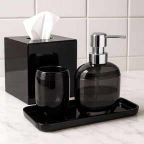 Set of four modern bathroom decor accessories from The Aurik Collection, featuring sleek, elegant design in a contemporary style.