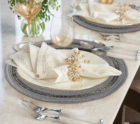 Set of four Vaiga Grace beaded placemats from The Vaiga Collection, elegant 14-inch decorative dining table décor.