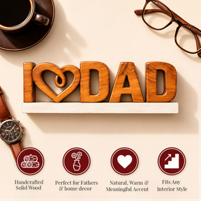 a wooden sign that says "I [heart] DAD" and is surrounded by various objects such as a cup, a pair of glasses, and a watch.